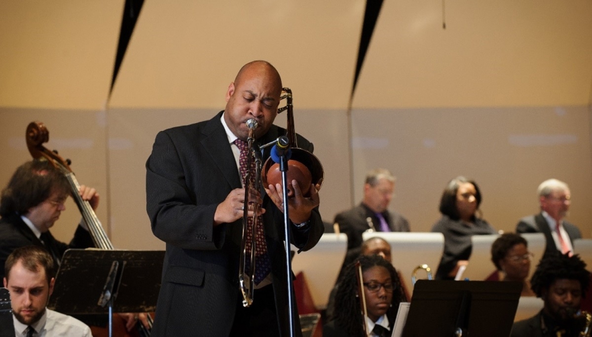 Dr. Isrea Butler playing the trombone